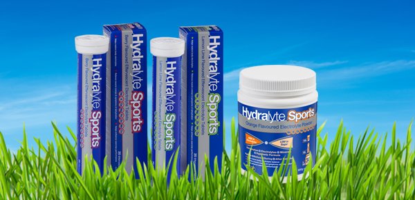 Hydralyte Sports Tablets & Powder displayed on grass